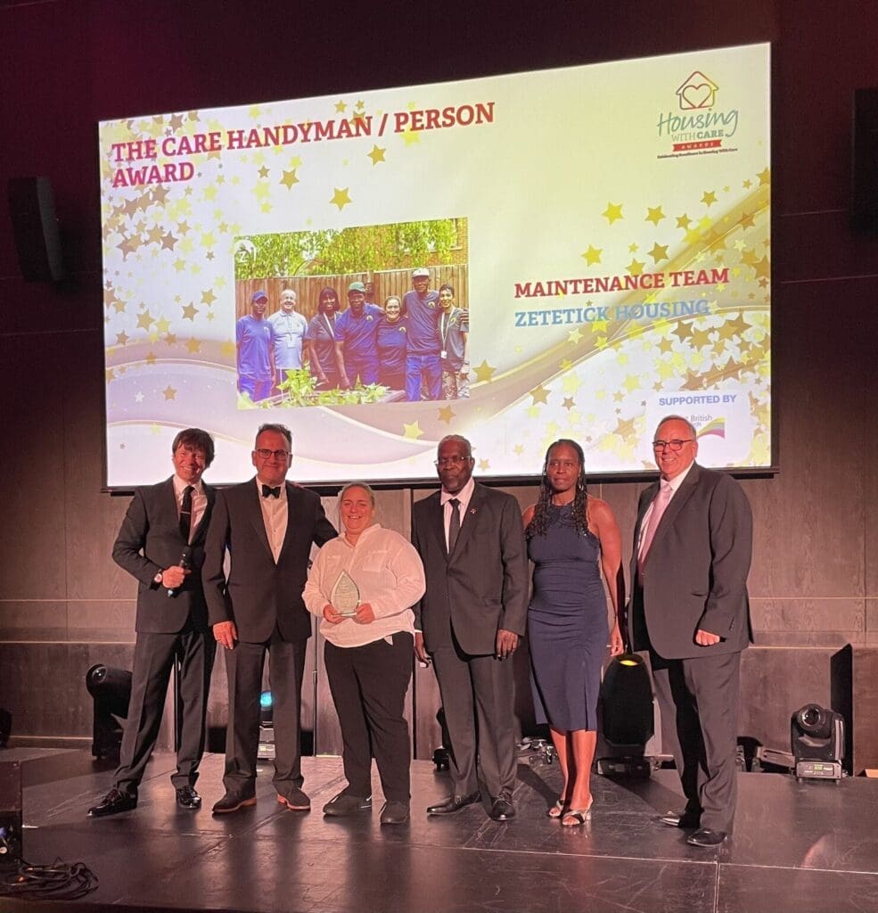 Award ceremony with winners on stage.