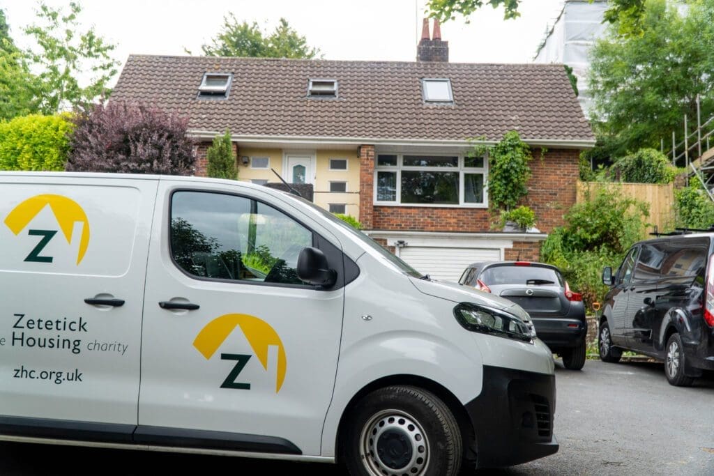 Zetetick van parked outside a tenant's home.
